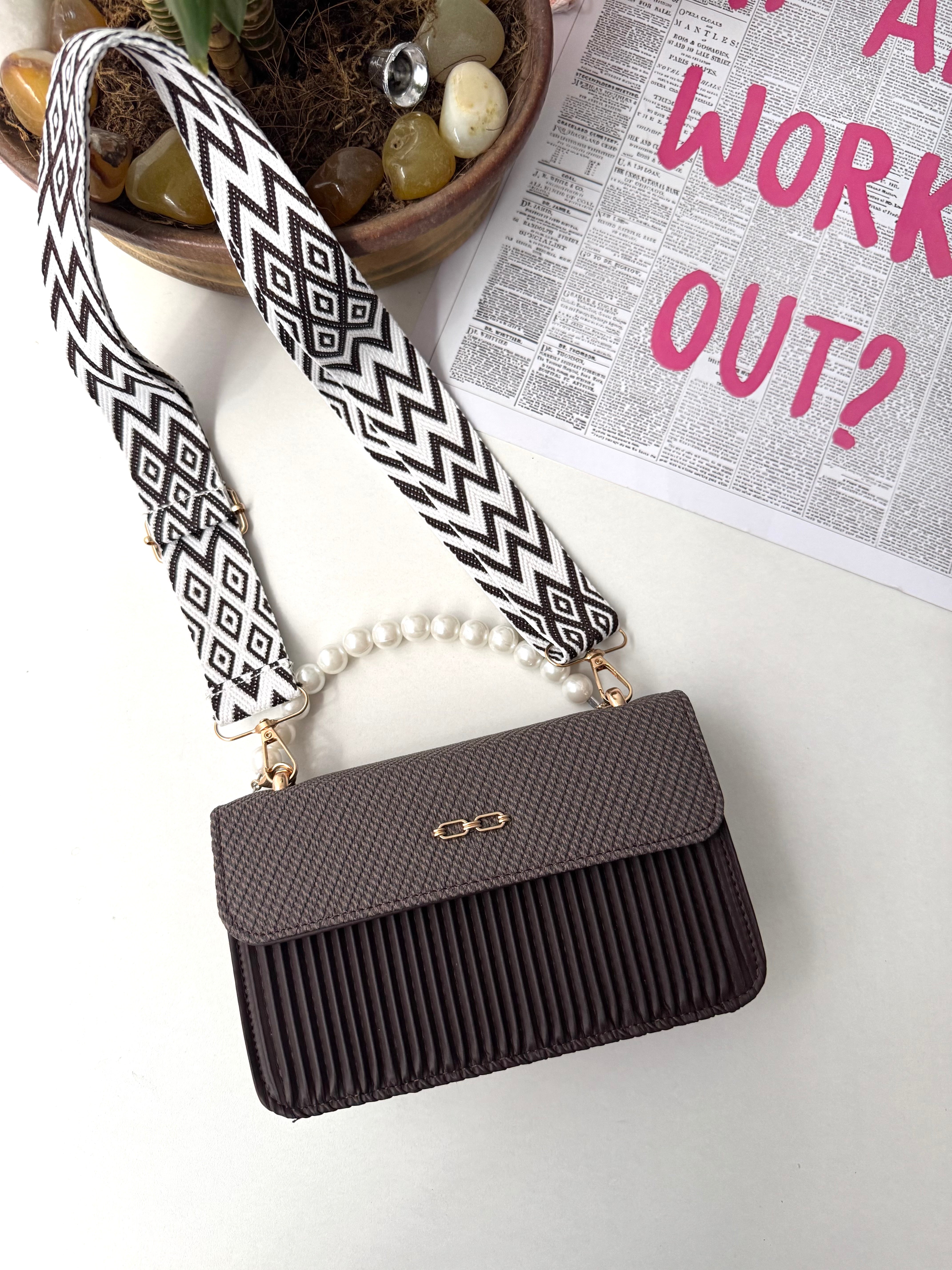 Pearl handle sling bag