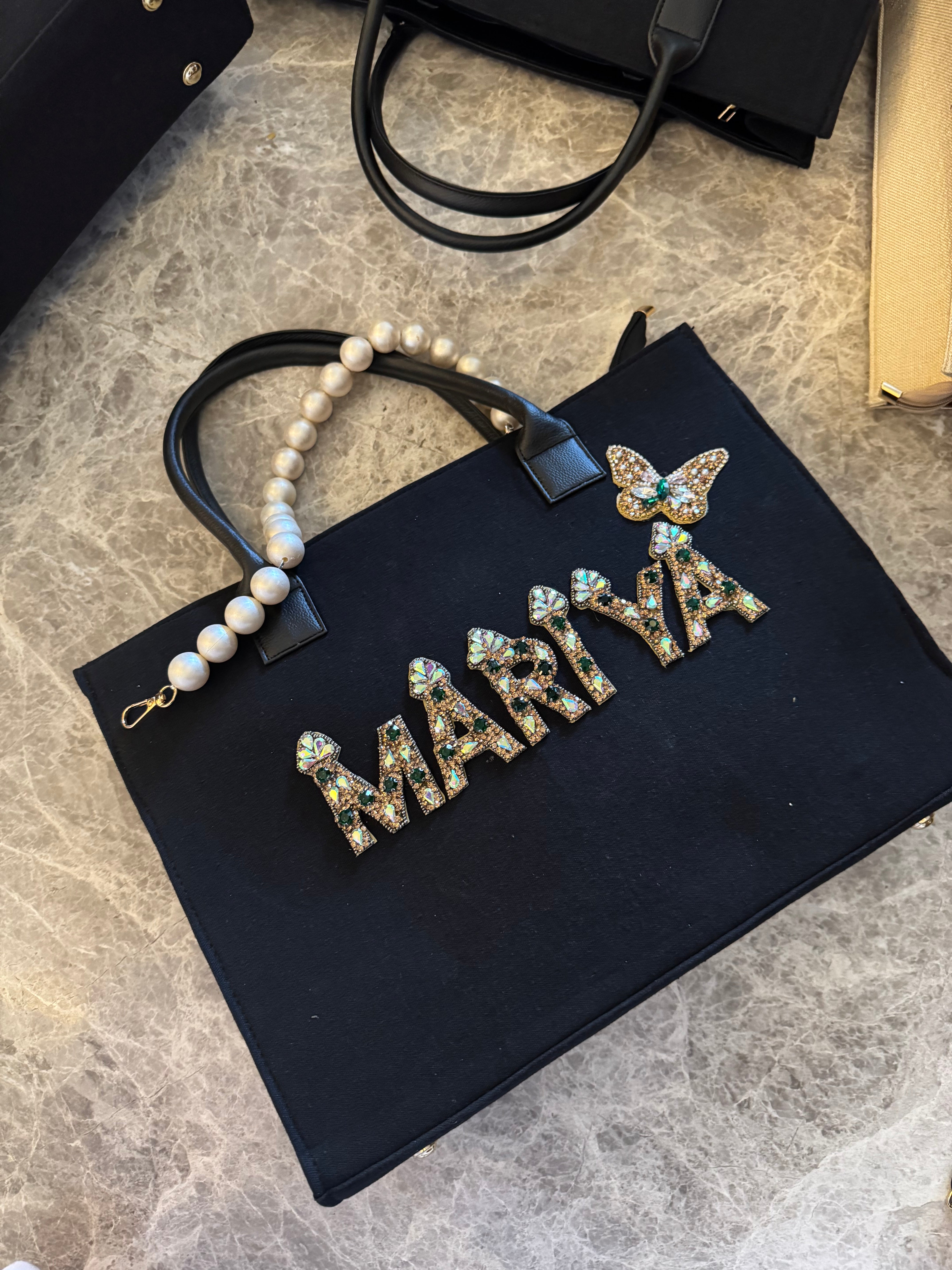 Canvas bag with pearl handle